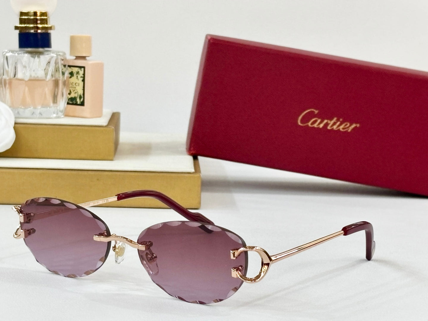 C DE RIMLESS ROUND FRAME SUNGLASSES CT0599S IN METAL
